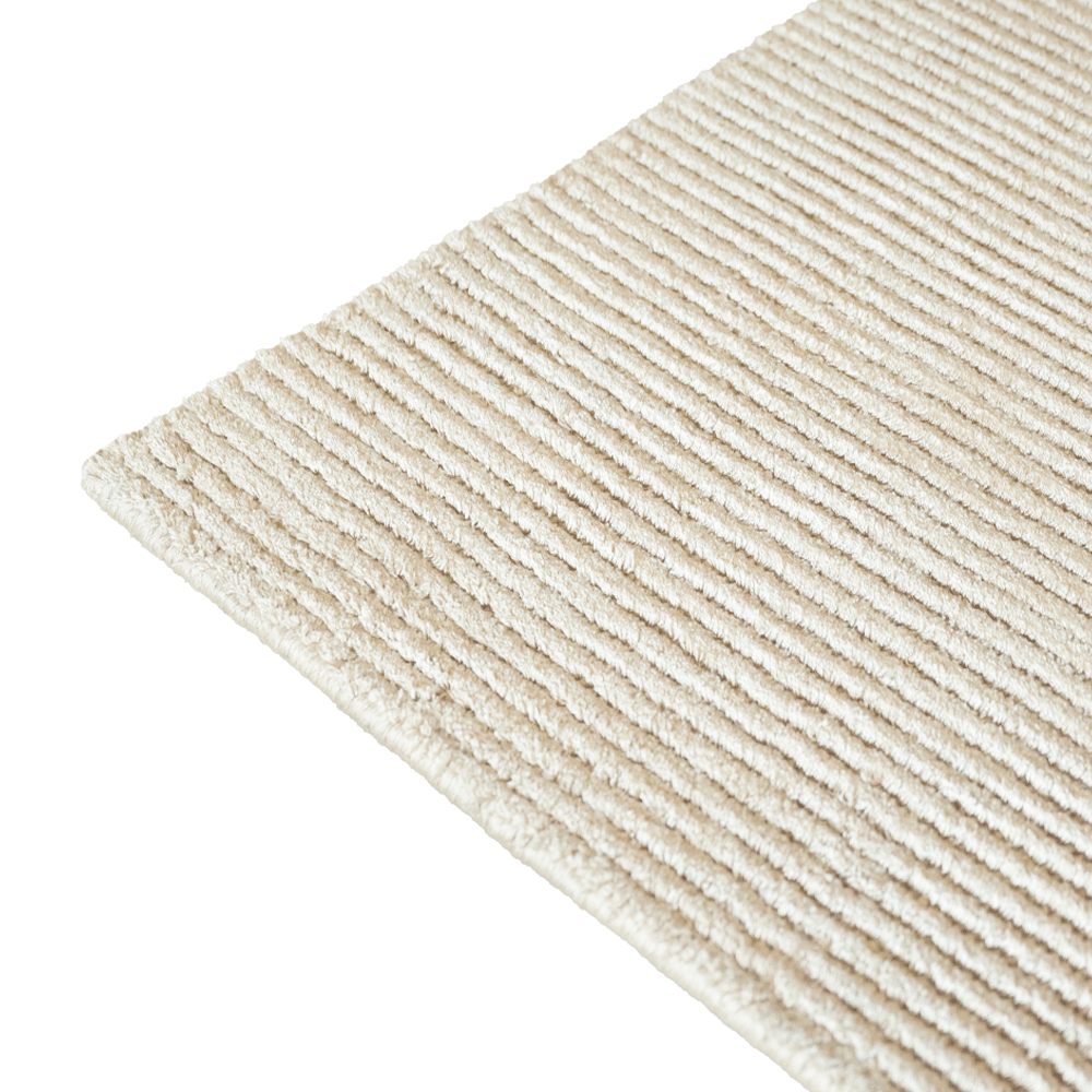 Detalle del tejido de la alfombra Basanti Latte de Tencel