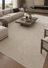 Alfombra Sahara Cream de lana en living con sofás claros y mesa de centro de madera
